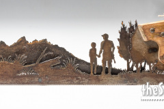 Custom-Carpenter-with-son-walking-in-trees-mountains