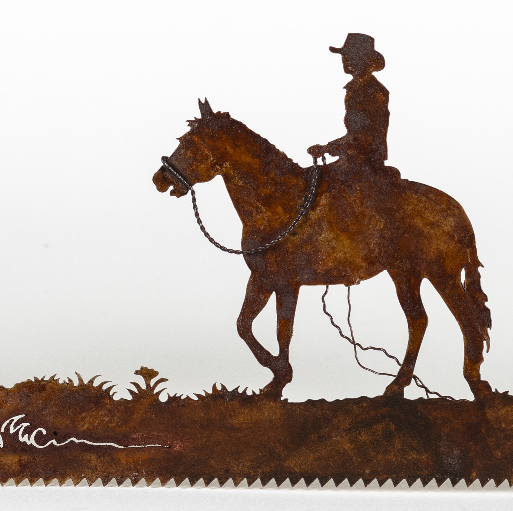 man riding horse metal saw art