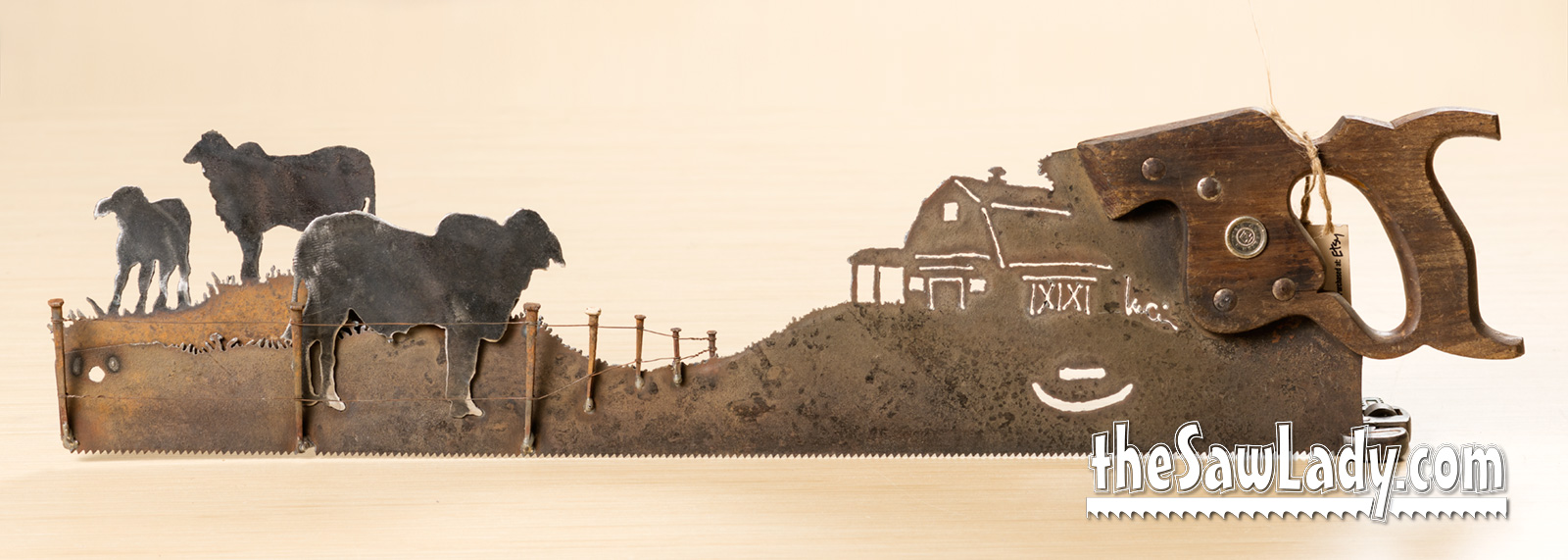 Vintage Brahman bulls hand cut metal hand saw wall art with natural patina rustic ranch decor