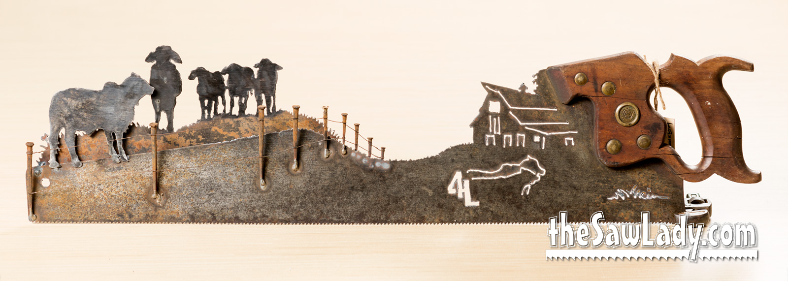 Vintage Brahman bulls hand cut metal hand saw wall art with natural patina rustic ranch decor