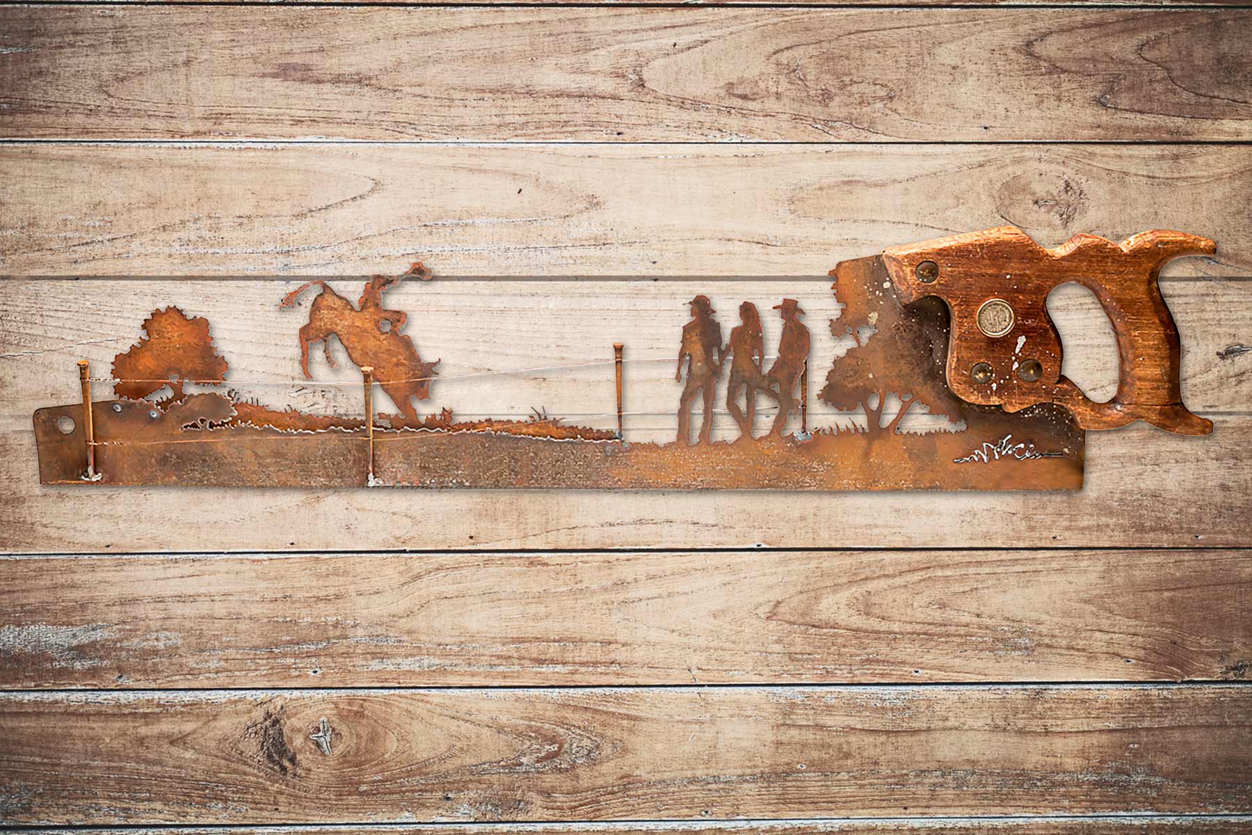 Vintage bull riding hand cut metal hand saw wall art with natural patina rustic Western decor
