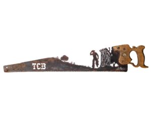 Vintage cowboy leaving the outhouse hand cut metal hand saw wall art with natural patina rustic Western decor