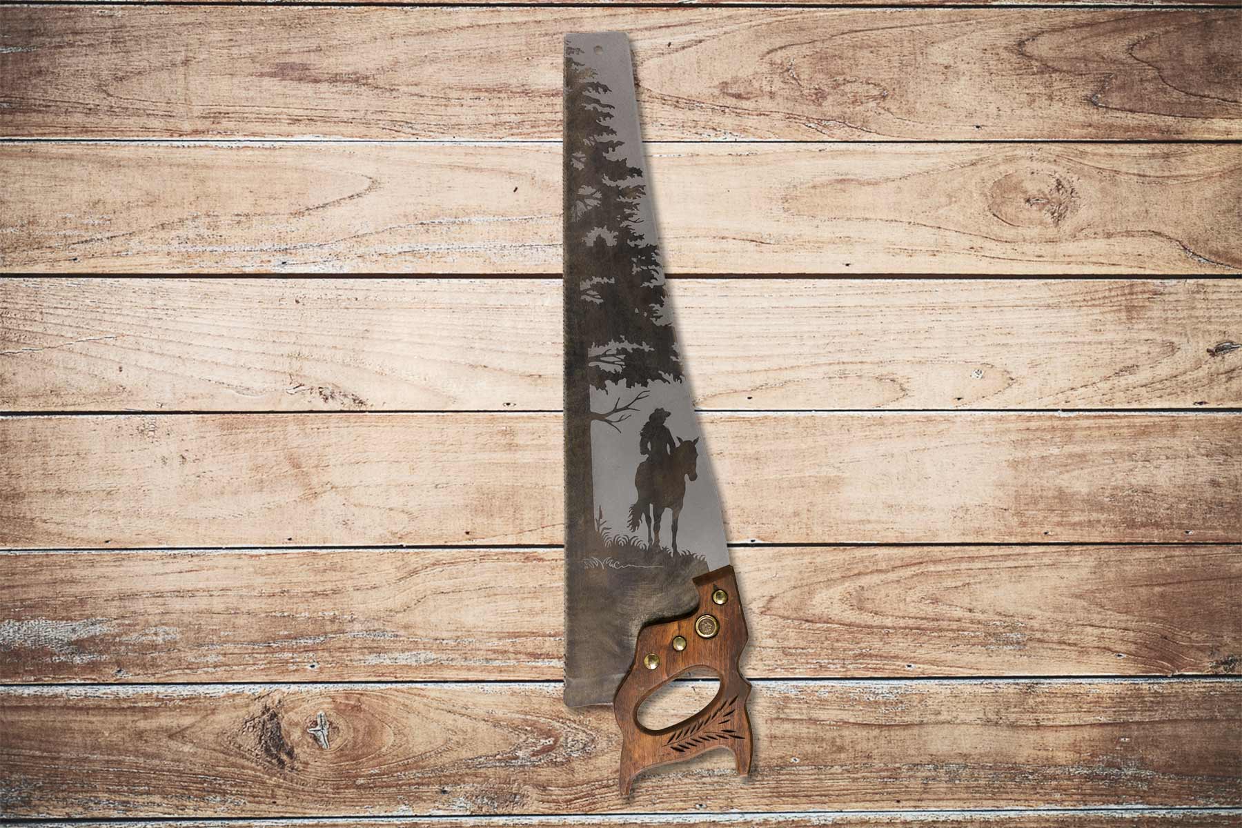 Cowgirl on horse saw art on vintage handsaw with rustic tree scene
